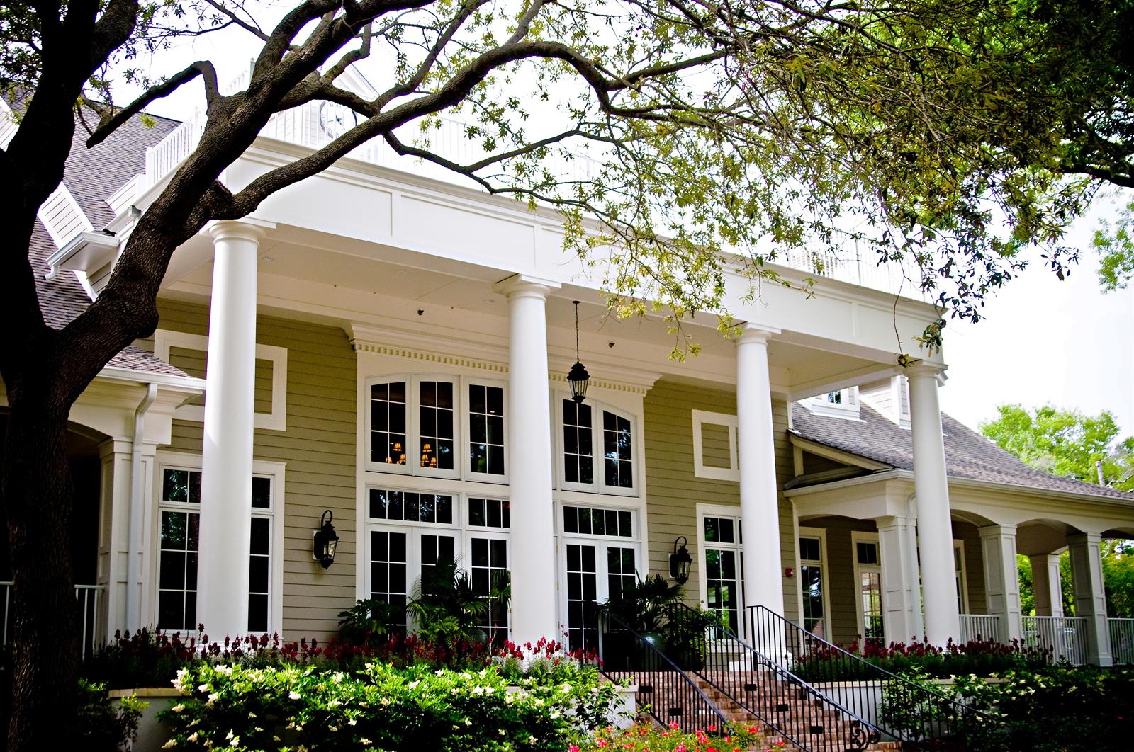 Port Royal clubhouse exterior with trees and entryway